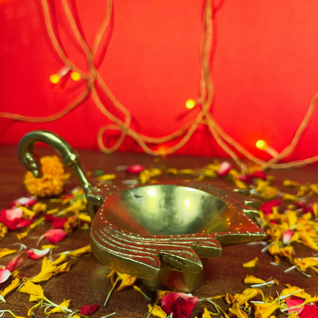 PITTALAM Brass Lotus Aarti Diya with Handle - Subtle Radiance